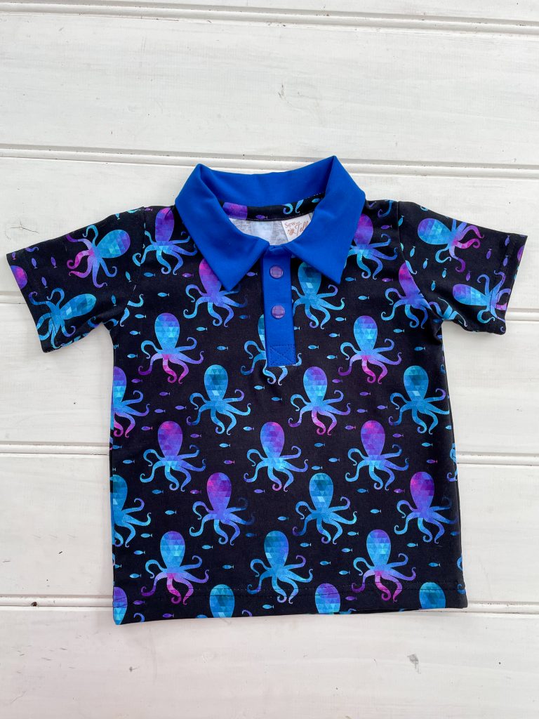 Dark blue polo shirt with octopus print flatlay