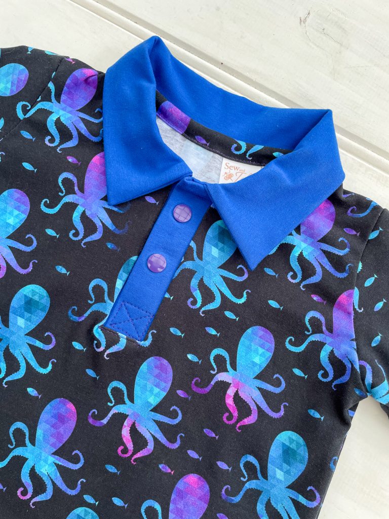 close up photo of a dark blue polo shirt with octopus print
