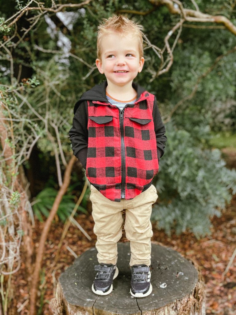 smiling kid photo with hands in pocket