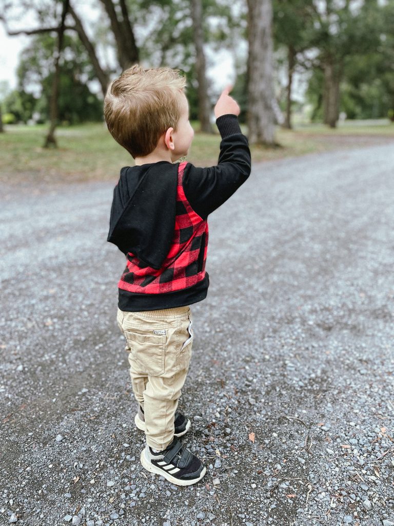 photo of a kid pointing at something