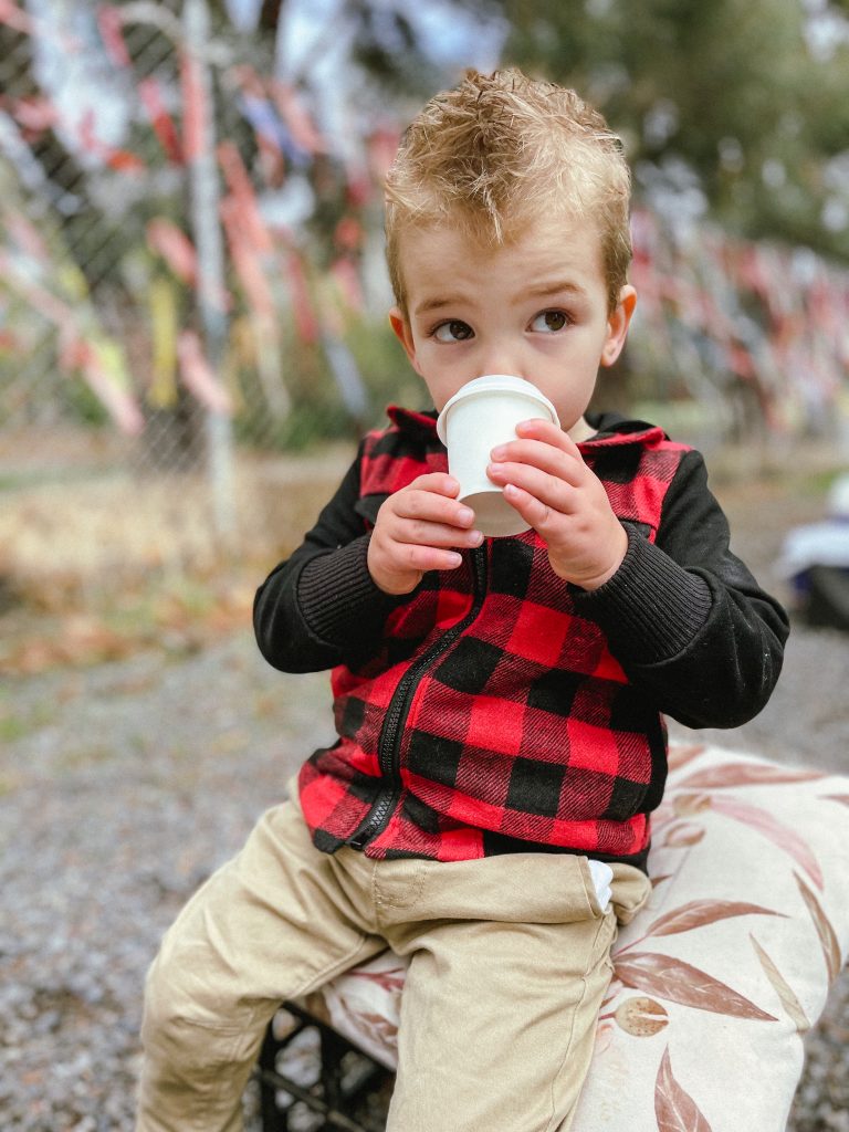 photo of a kid drinking something