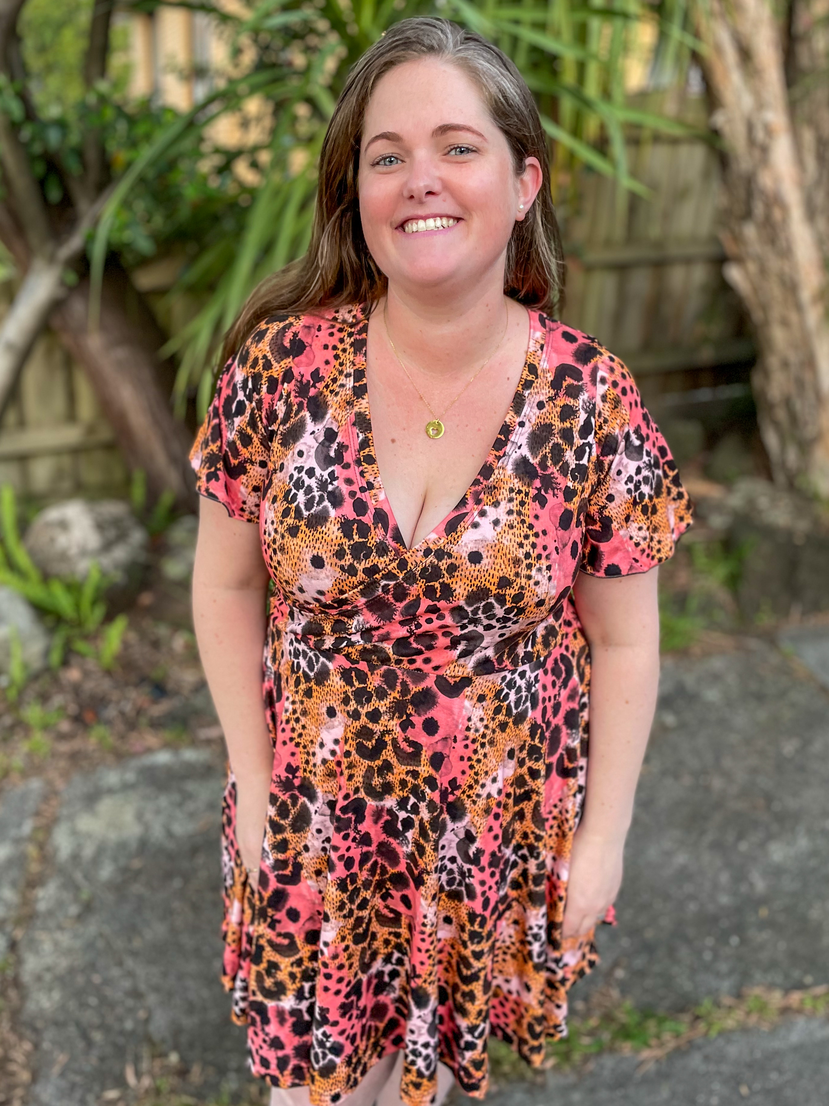 Leopard print dress adds flair to woman's photo.